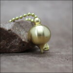 Pendule Aquarius laiton doré