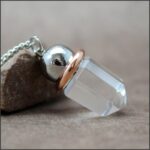 Pendule cristal clair et cuivre