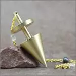 Pendule en laiton "harmonie" de Jocelyne Fangain