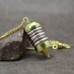 Pendule métal 3 couleurs