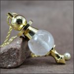 Pendule cristal de roche et laiton
