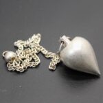 Pendule goutte laiton déclassé