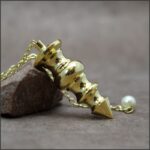 Pendule divinatoire laiton doré